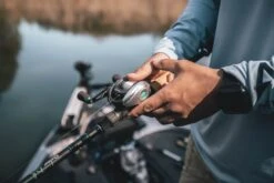 Quantum Energy S3 Baitcasting Reel -Fishing Equipment Store energy bc reel and rod closeup lifestyle