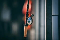 Quantum Energy S3 Baitcasting Reel -Fishing Equipment Store energy bc reel and rod side lifestyle